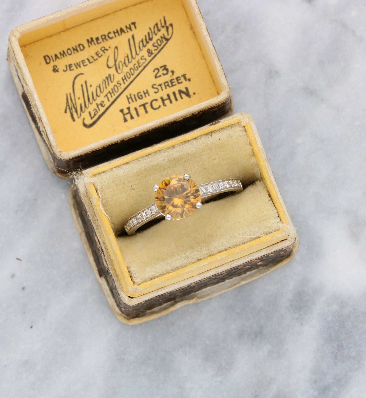 18ct golden zircon and diamond ring