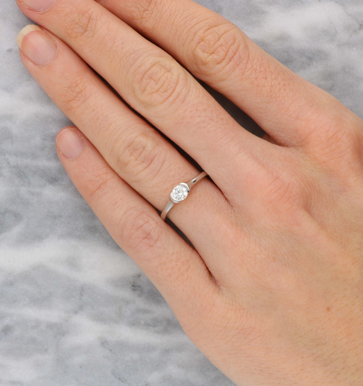 18ct tension-set diamond engagement ring