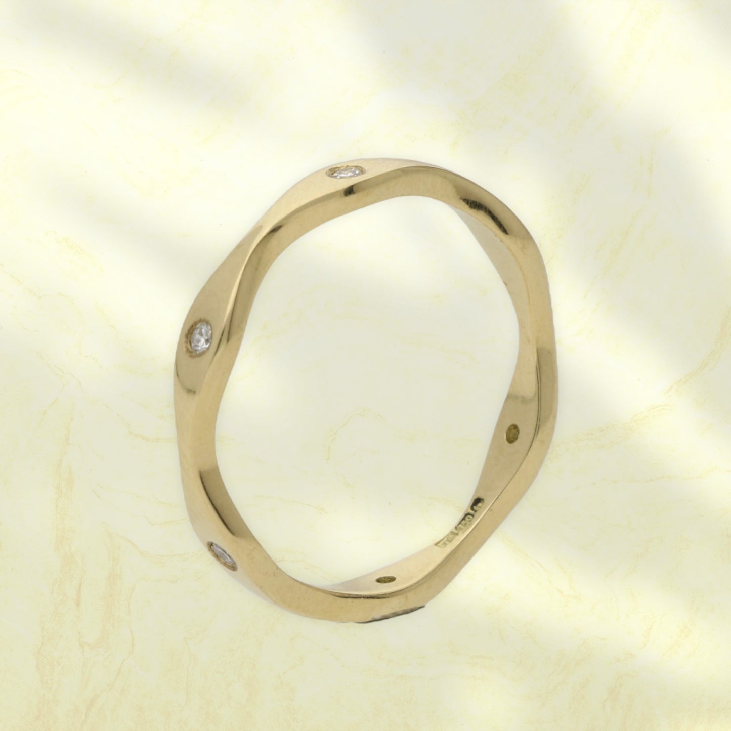 Diamond-set wave eternity ring